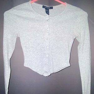 A grey long sleeved crop top from Forever 21. Worn 3 times. Great condition.
